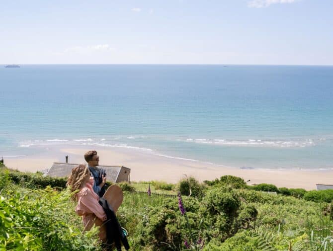 Woman and man overlooking a sea view